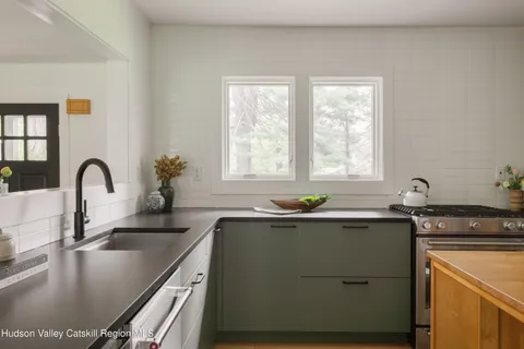 a kitchen with a sink and a window