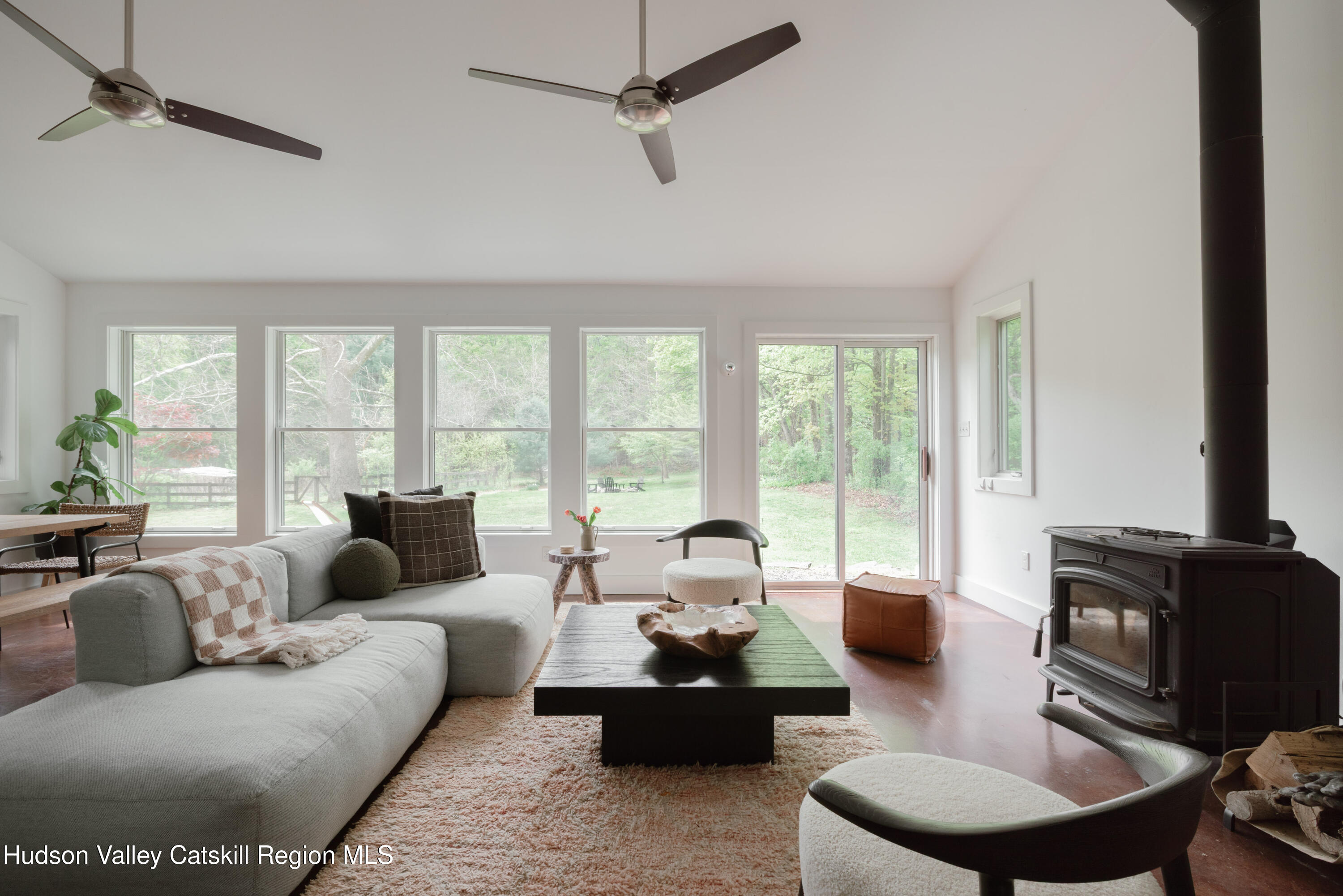 631 Granite Road Kerhonkson, NY 12446 - Photo 2 of 27 a living room with furniture and a floor to ceiling window