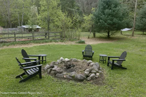 a garden with a bench and some trees