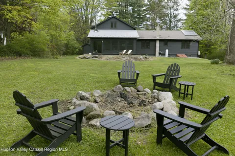 a view of a chairs and table in the patio