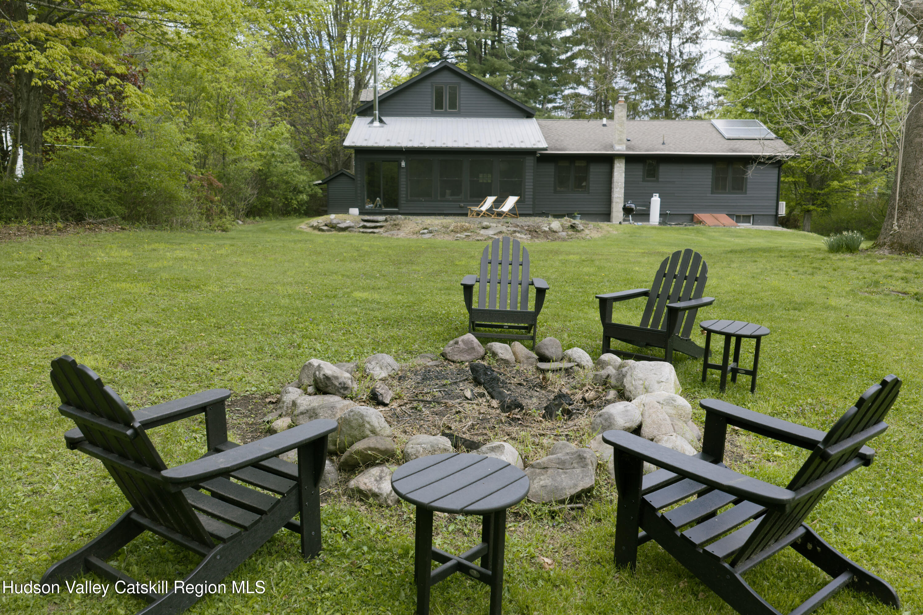 631 Granite Road Kerhonkson, NY 12446 - Photo 7 of 27 a view of a chairs and table in the patio