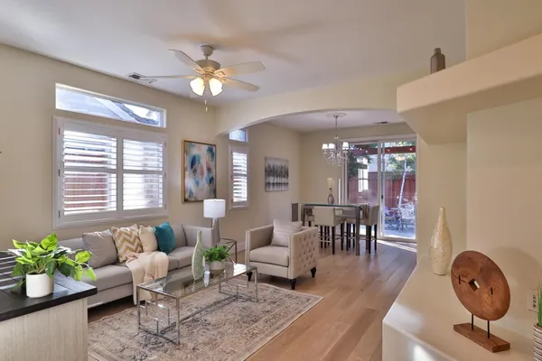 a bed room with a bed and a chandelier