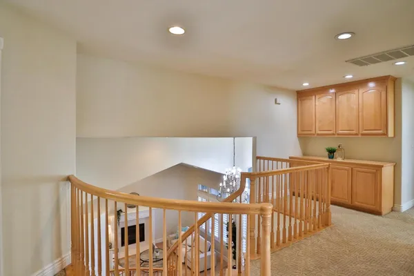 a bathroom with a sink and mirror with toilet