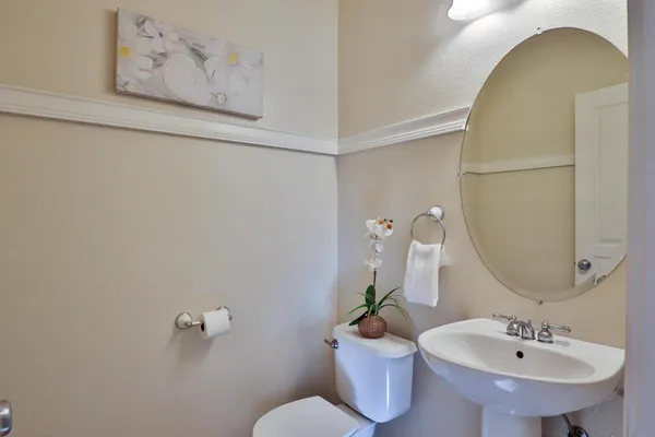 a bathroom with a sink a vanity and window