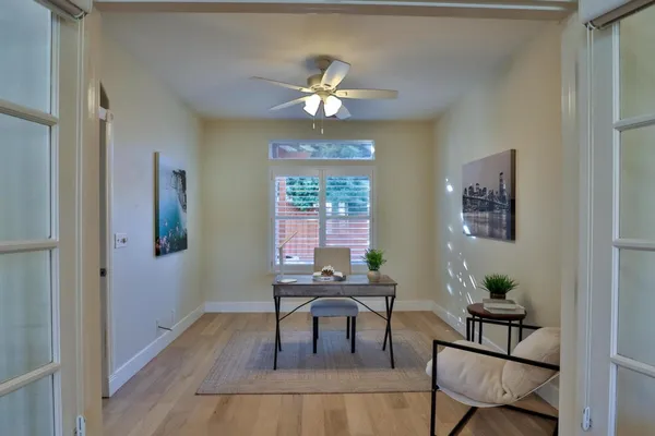 a kitchen with kitchen island granite countertop a sink a counter space appliances and cabinets