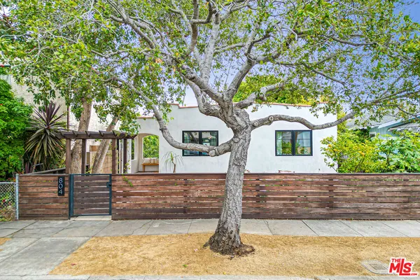 a view of a house with a tree