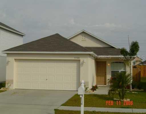 11320 Ivy Flower Loop Riverview, FL 33578 - Photo 1 of 1 a front view of a house with garden