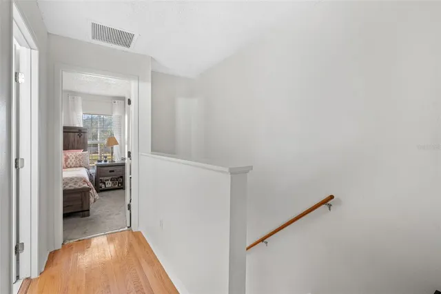 a bedroom with a bed and ceiling fan