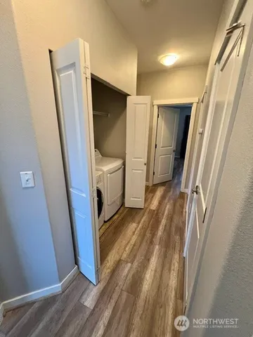 a view of front door and wooden floor