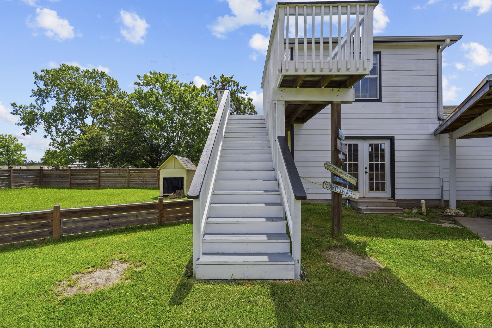7009 Avenue R Santa Fe, TX 77510 - Photo 42 of 48 Stairs and deck to gameroom. French doors below are to the office and full bathroom.