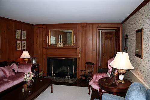 88 Pochet Road Orleans, MA 02653 - Photo 11 of 22 a living room with furniture and a fireplace