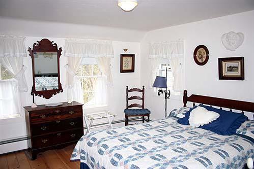 88 Pochet Road Orleans, MA 02653 - Photo 15 of 22 a bedroom with a bed and a dresser in it