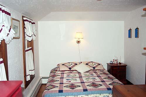 88 Pochet Road Orleans, MA 02653 - Photo 17 of 22 a bedroom with a bed and a mirror