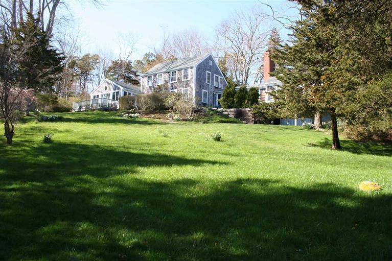 88 Pochet Road Orleans, MA 02653 - Photo 2 of 22 a view of a big yard with large trees