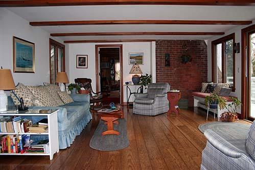 88 Pochet Road Orleans, MA 02653 - Photo 6 of 22 a living room with furniture and a wooden floor