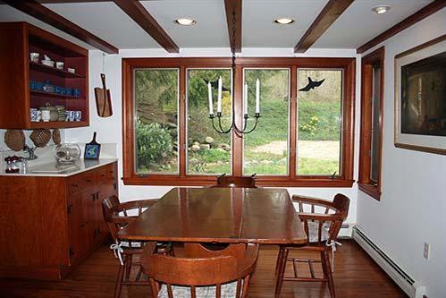 88 Pochet Road Orleans, MA 02653 - Photo 9 of 22 a view of a dining room with furniture window and wooden floor