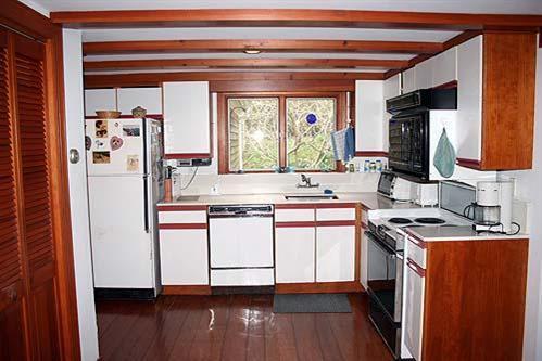 88 Pochet Road Orleans, MA 02653 - Photo 10 of 22 a kitchen with stainless steel appliances granite countertop a refrigerator stove and sink