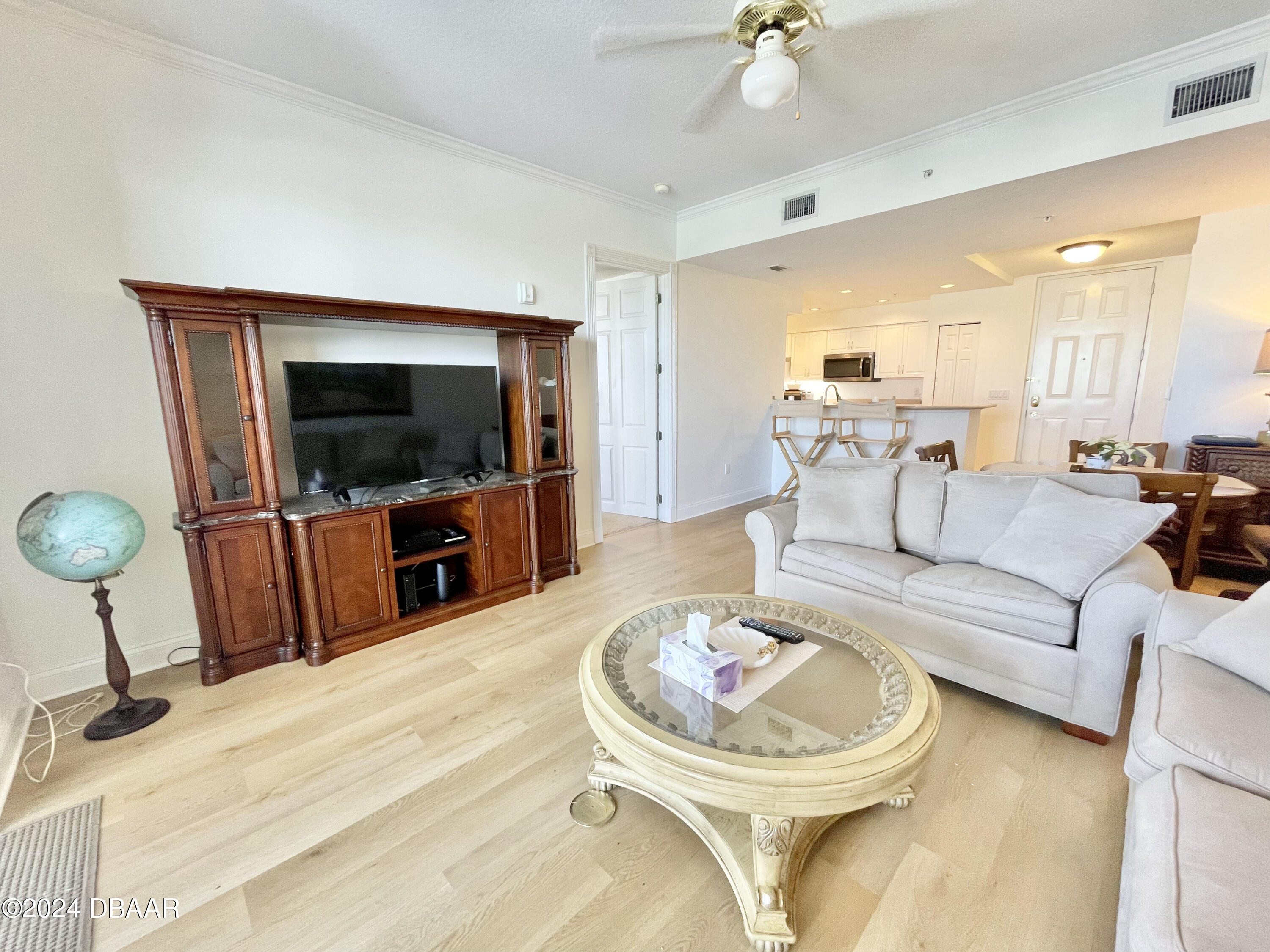 4626 Harbour Village Boulevard, Unit 3505 Ponce Inlet, FL 32127 - Photo 13 of 38 a living room with furniture and a flat screen tv