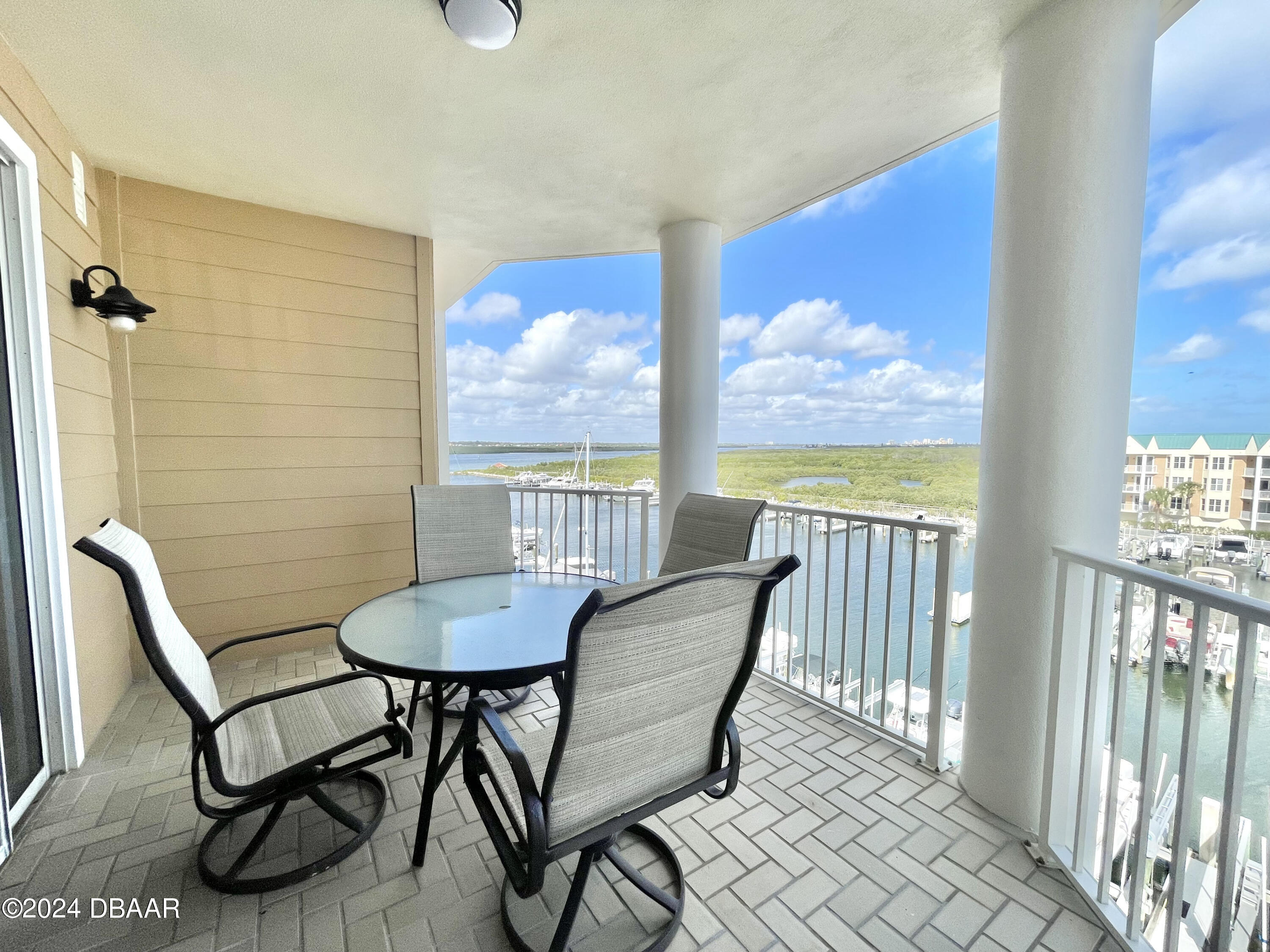 4626 Harbour Village Boulevard, Unit 3505 Ponce Inlet, FL 32127 - Photo 20 of 38 a view of a room with furniture wooden floor and window
