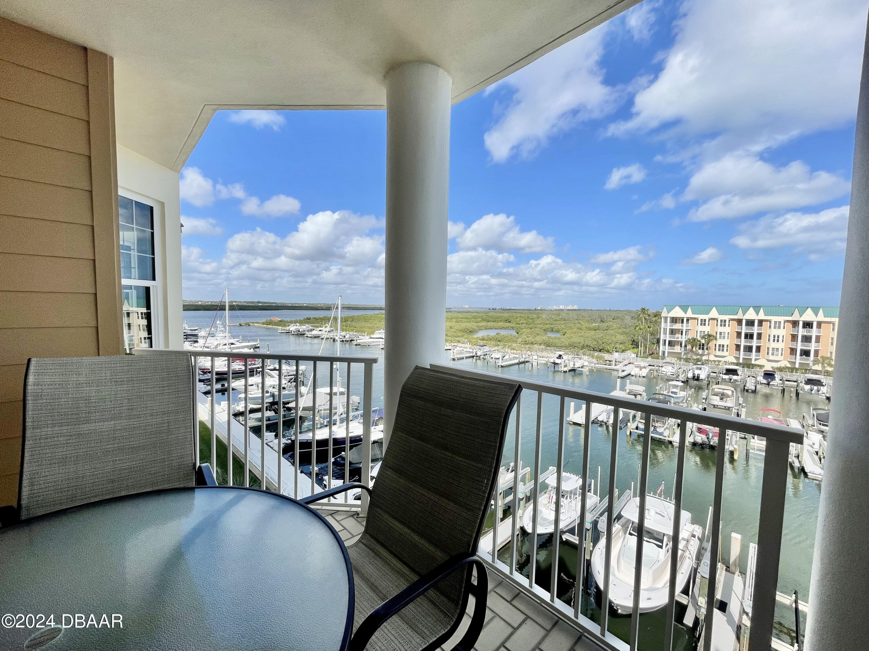 4626 Harbour Village Boulevard, Unit 3505 Ponce Inlet, FL 32127 - Photo 2 of 38 a view of a balcony with furniture
