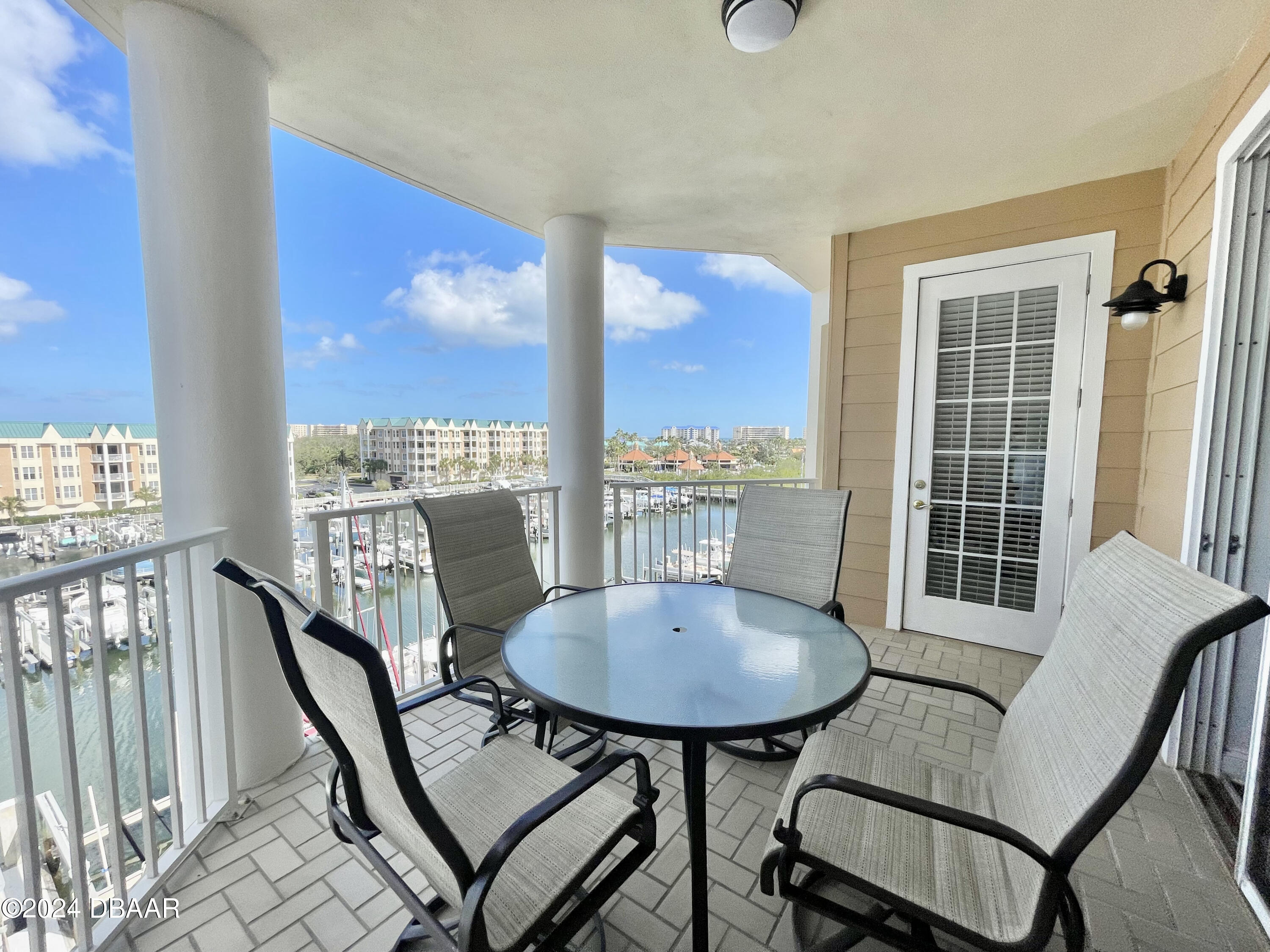 4626 Harbour Village Boulevard, Unit 3505 Ponce Inlet, FL 32127 - Photo 22 of 38 a view of a city from a dining room with furniture window and wooden floor