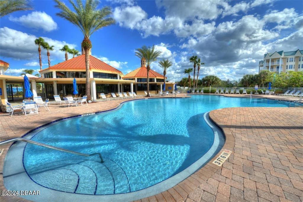 4626 Harbour Village Boulevard, Unit 3505 Ponce Inlet, FL 32127 - Photo 37 of 38 a view of a swimming pool with a patio