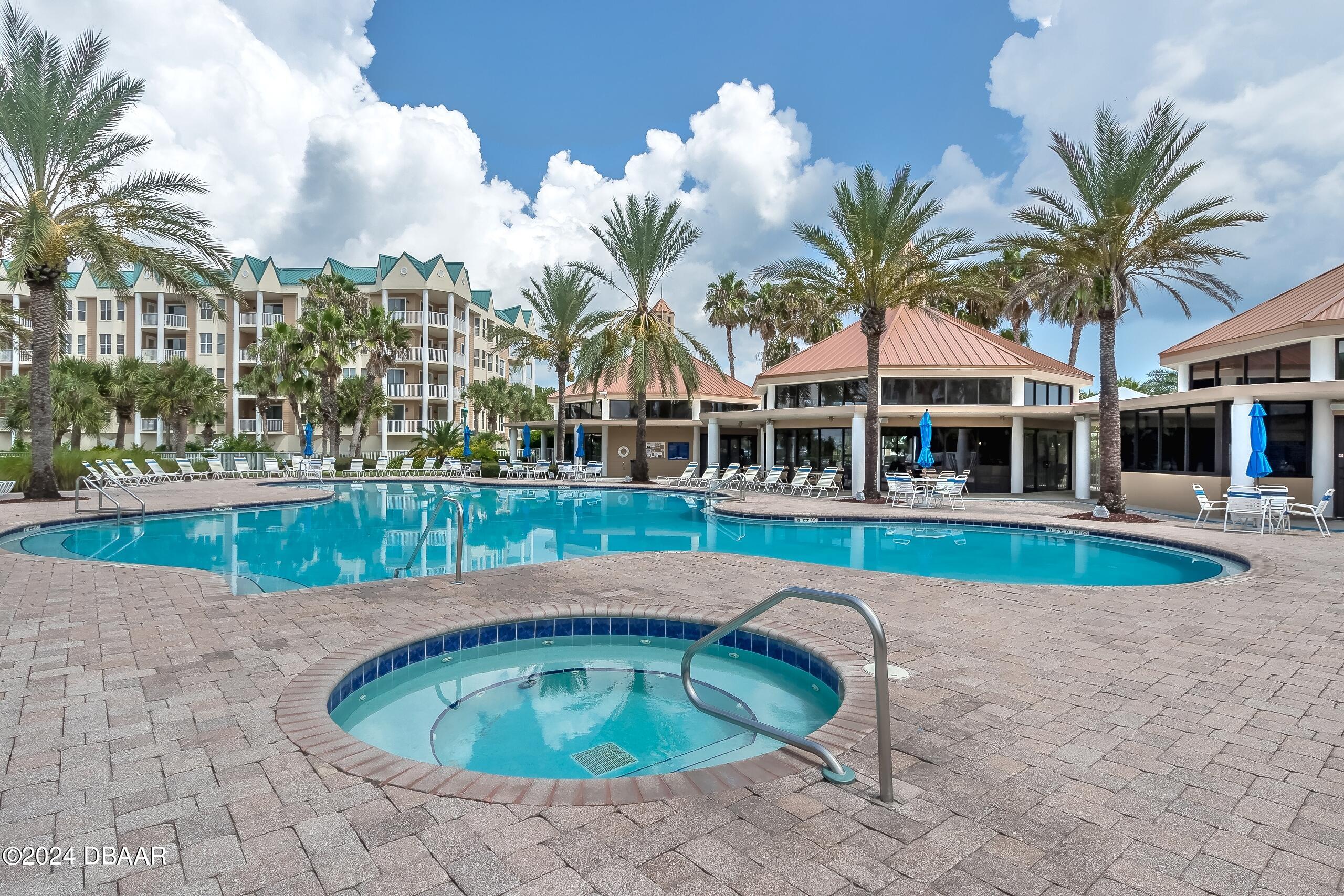 4626 Harbour Village Boulevard, Unit 3505 Ponce Inlet, FL 32127 - Photo 38 of 38 a swimming pool with outdoor seating and yard