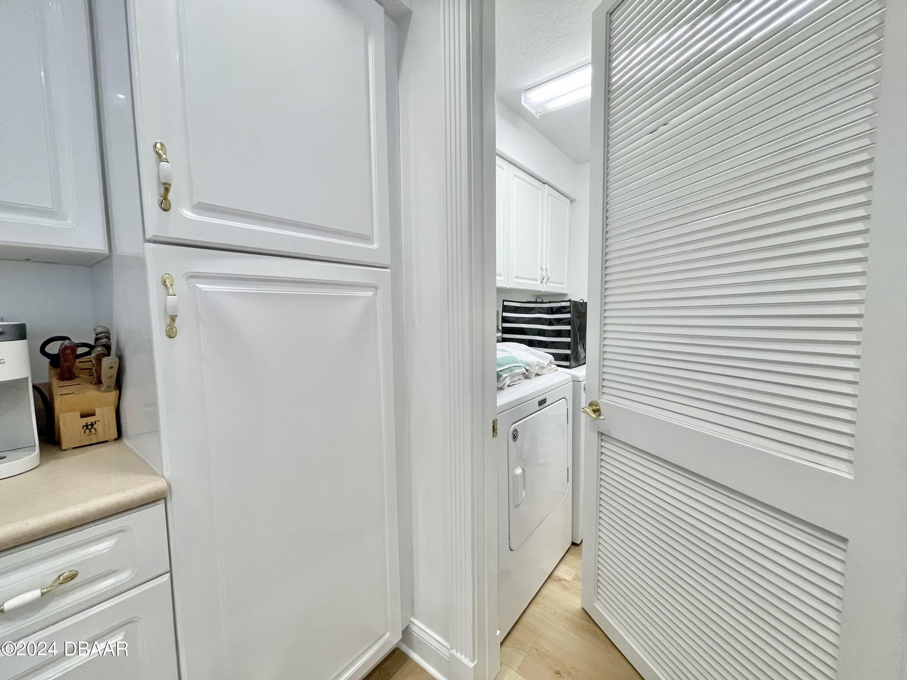 4626 Harbour Village Boulevard, Unit 3505 Ponce Inlet, FL 32127 - Photo 7 of 38 a utility room with dryer and washer