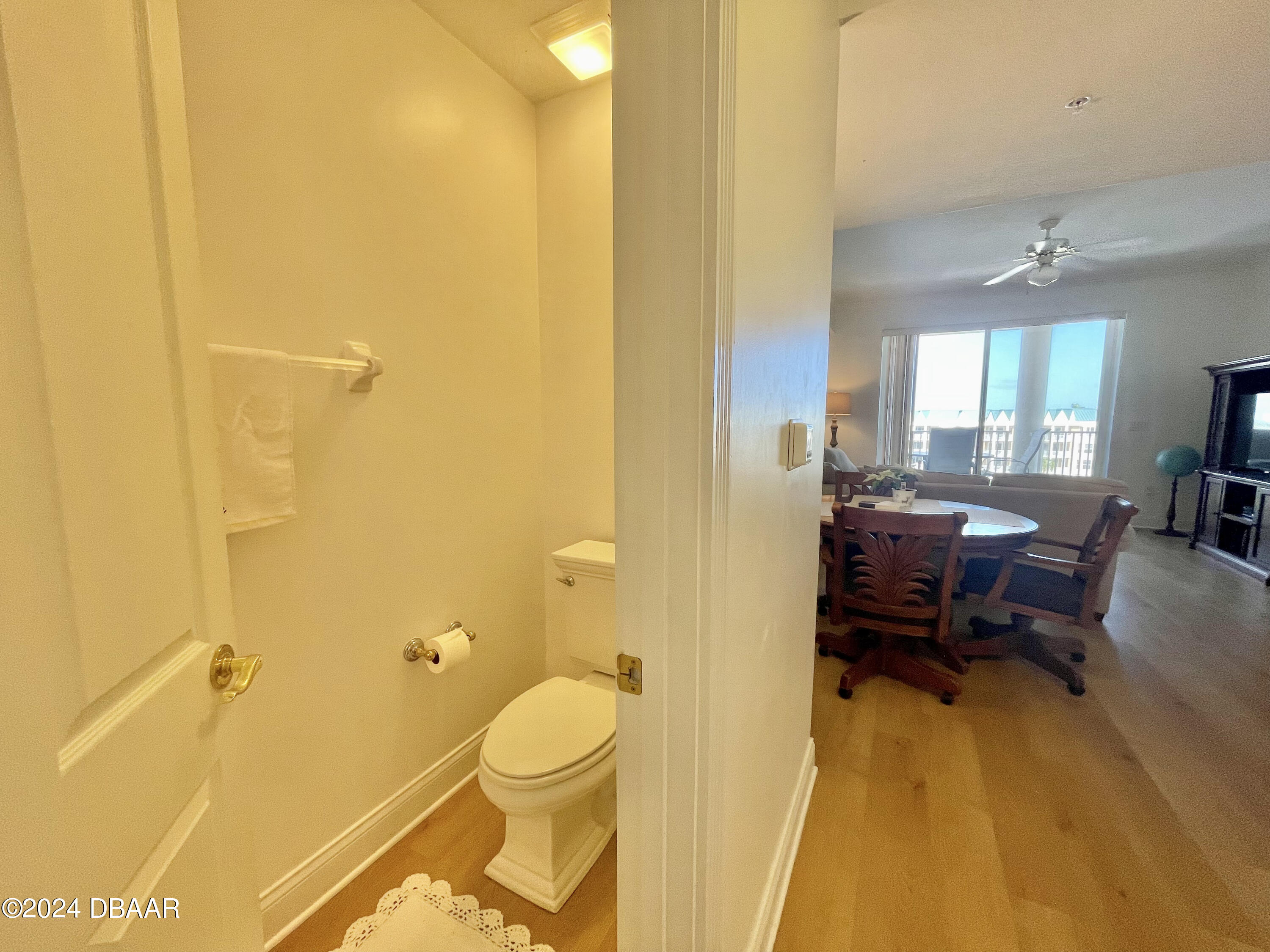 4626 Harbour Village Boulevard, Unit 3505 Ponce Inlet, FL 32127 - Photo 9 of 38 a living room with a couch and wooden floor