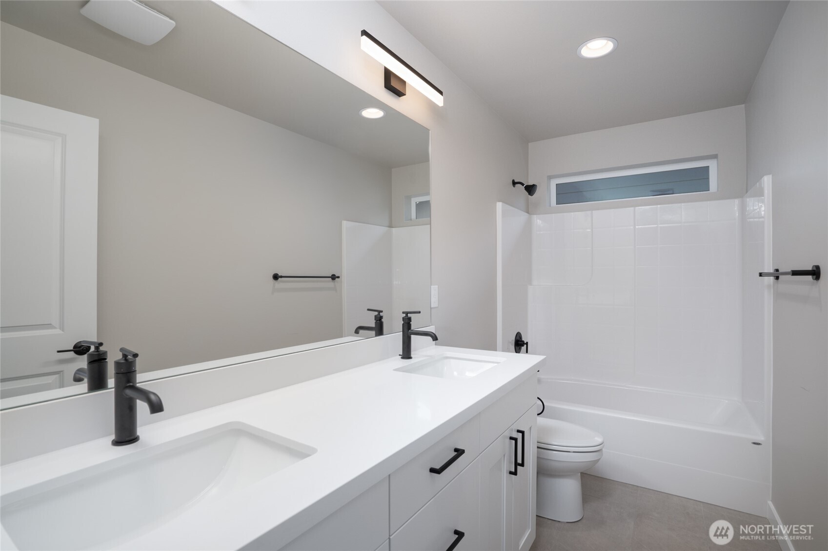 2421 Ridgeway Drive Oak Harbor, WA 98277 - Photo 11 of 12 a bathroom with a sink a toilet and shower