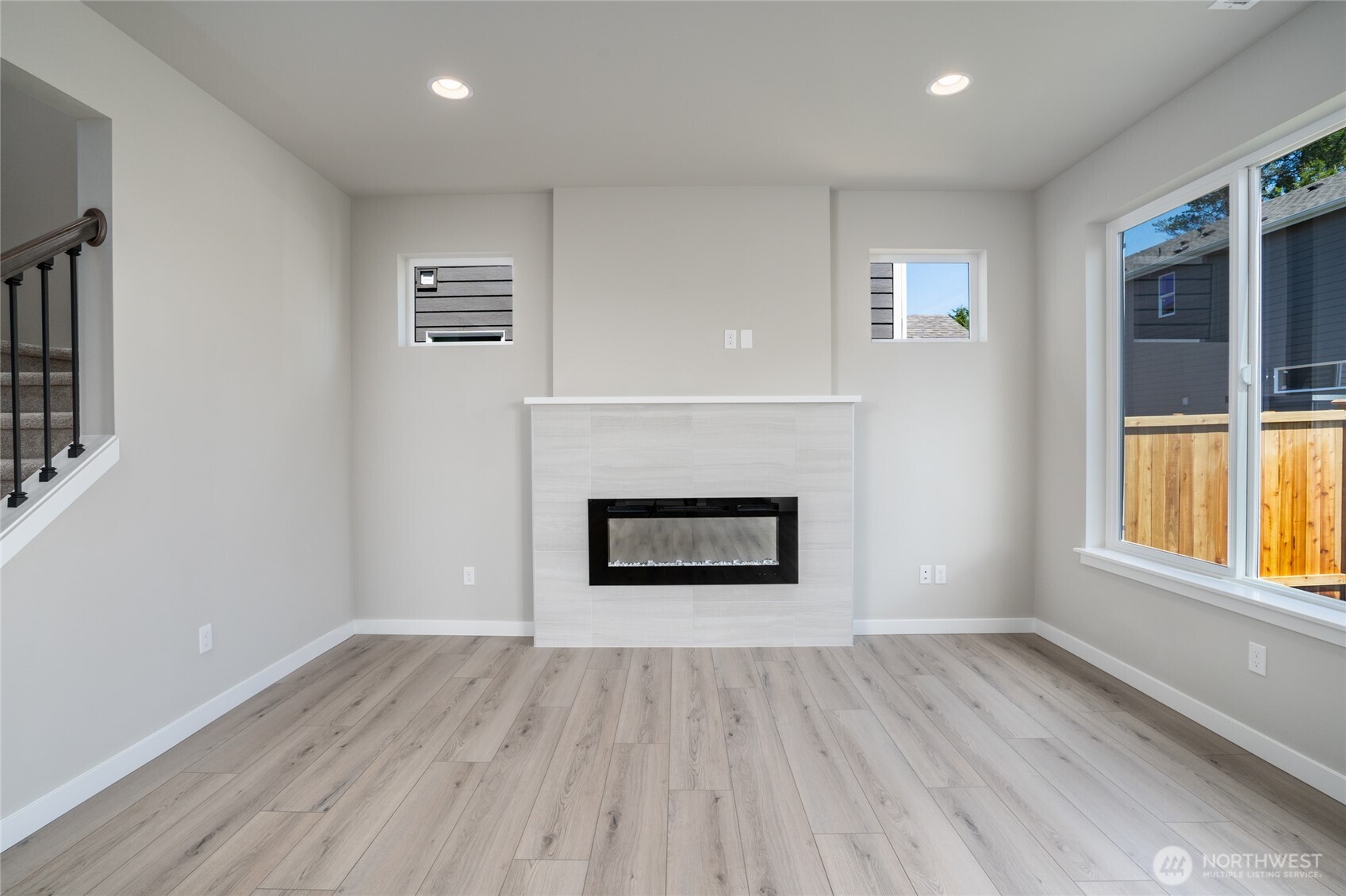 2421 Ridgeway Drive Oak Harbor, WA 98277 - Photo 4 of 12 an empty room with windows and fireplace