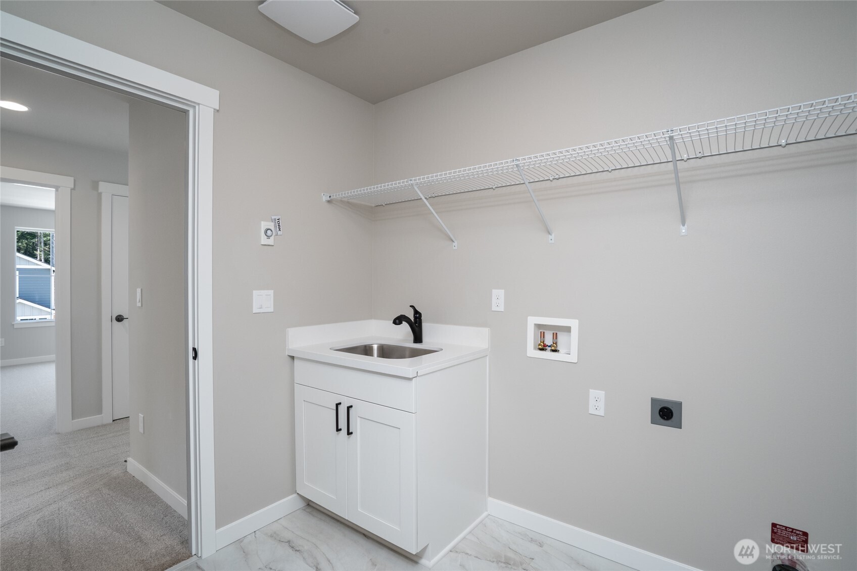 2421 Ridgeway Drive Oak Harbor, WA 98277 - Photo 10 of 12 a view of a storage & utility room with a sink