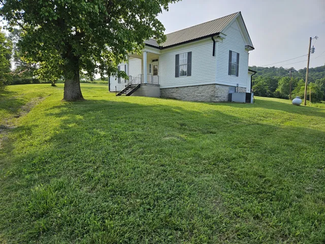 a backyard of a house with lots of green space