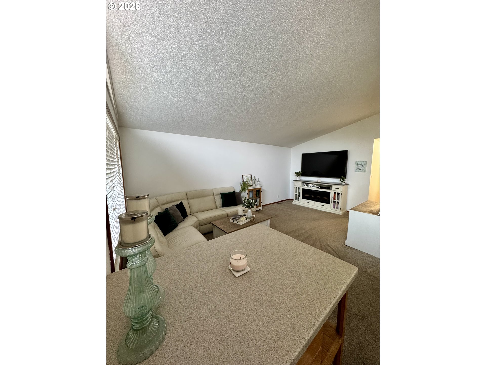 1091 Longridge Drive Springfield, OR 97478 - Photo 2 of 21 a living room with furniture and a flat screen tv