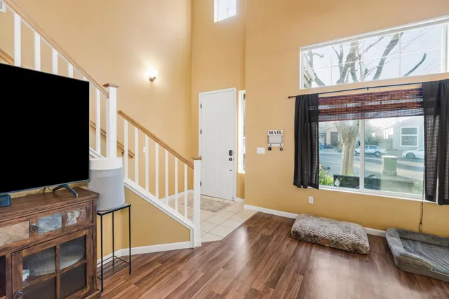 a view of a dining room with furniture window and wooden floor