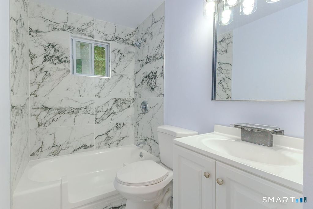 17 Rhoda Lane Bristol, CT 06010 - Photo 16 of 22 a bathroom with a sink toilet and shower