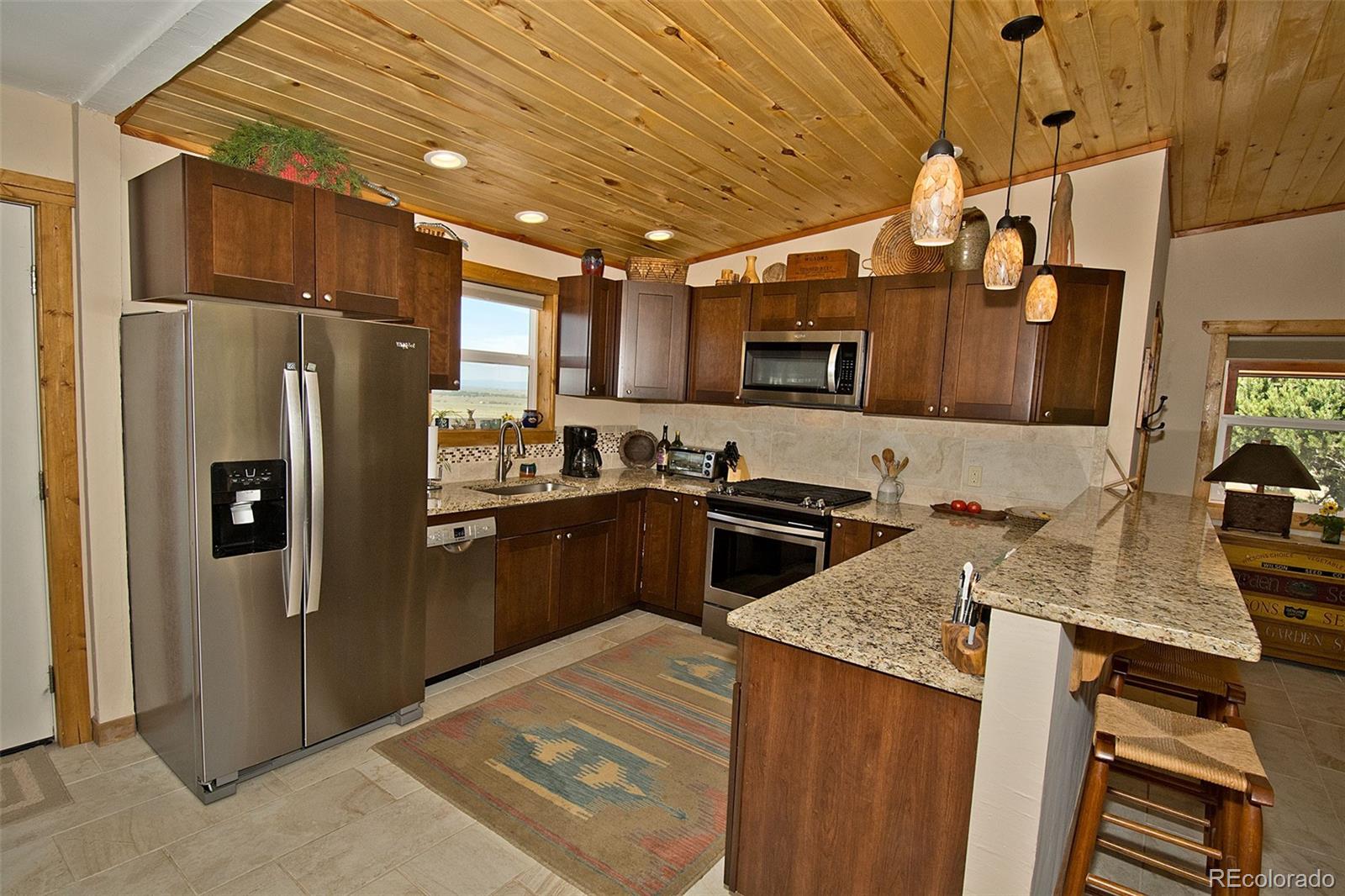 3421 Camino Del Rey Crestone, CO 81131 - Photo 14 of 41 a kitchen with a refrigerator sink and stove