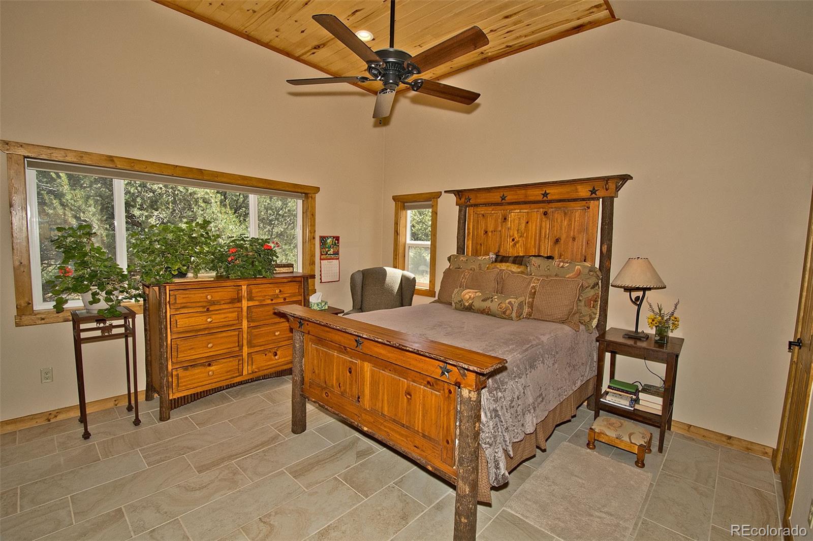 3421 Camino Del Rey Crestone, CO 81131 - Photo 19 of 41 a bed room with a bed and a large window
