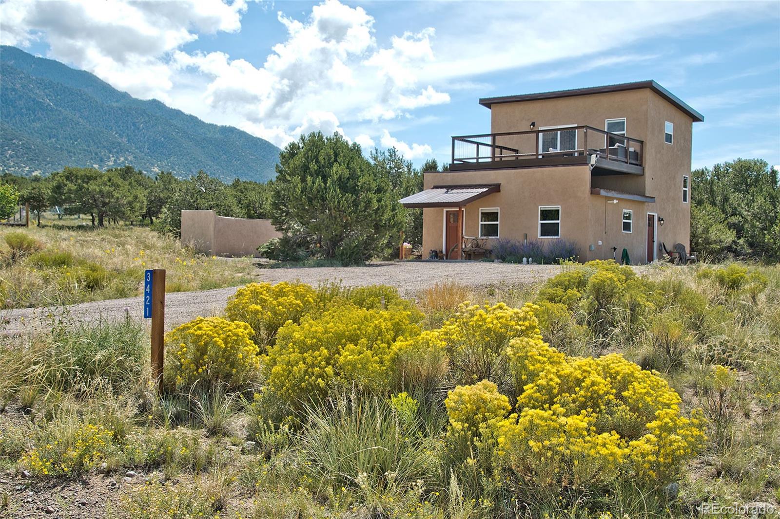 3421 Camino Del Rey Crestone, CO 81131 - Photo 2 of 41 a front view of a house with a yard