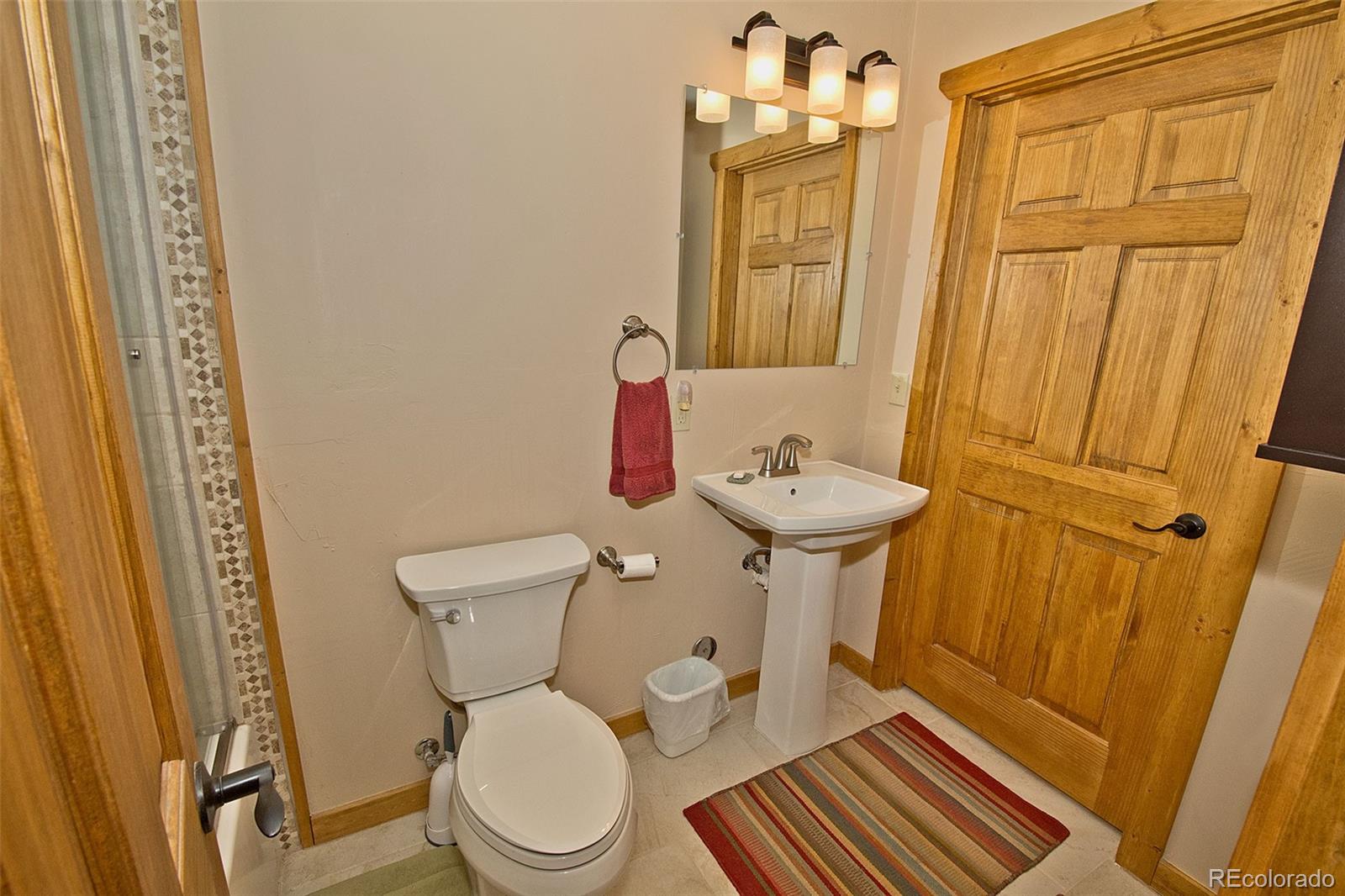 3421 Camino Del Rey Crestone, CO 81131 - Photo 23 of 41 a bathroom with a toilet a sink and a mirror