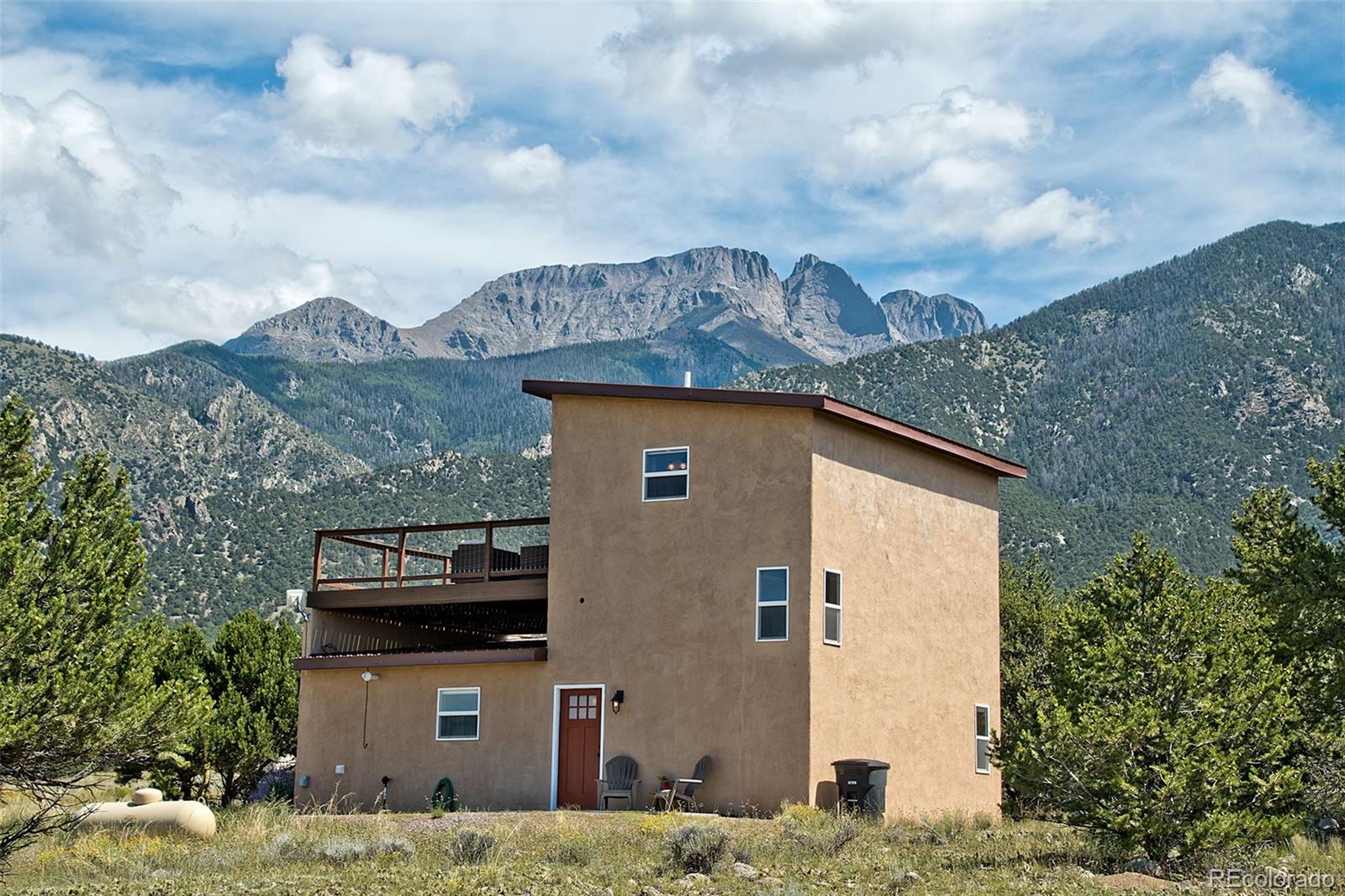 3421 Camino Del Rey Crestone, CO 81131 - Photo 3 of 41 a front view of a house with a yard