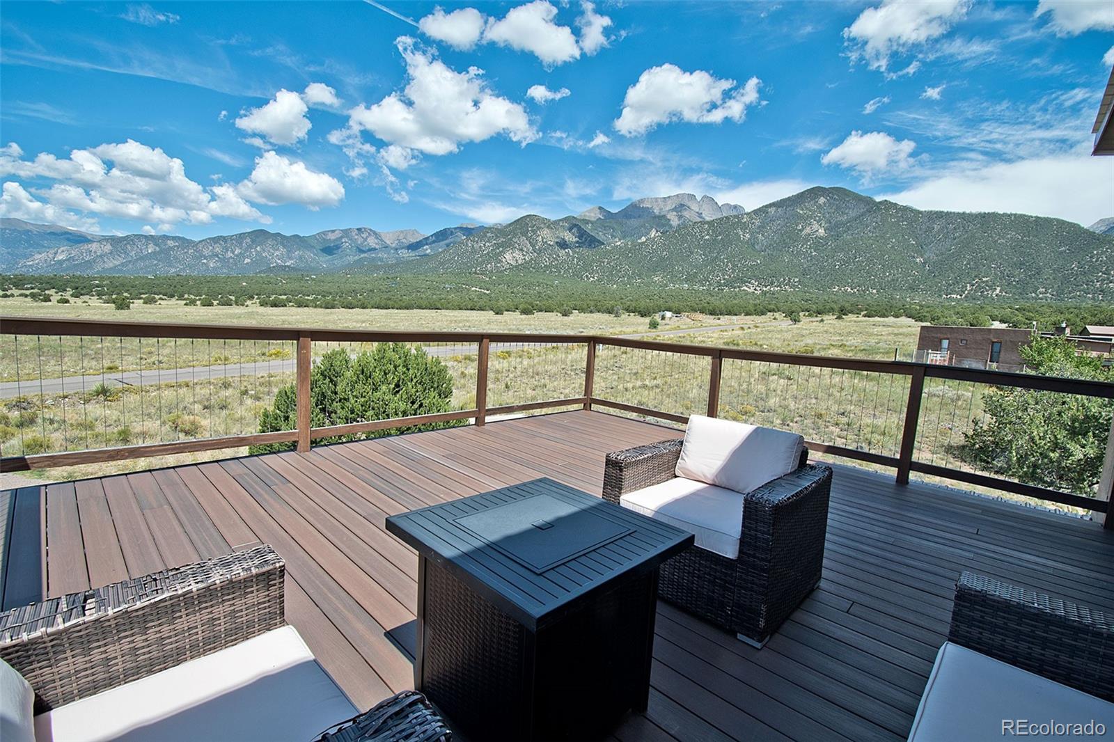 3421 Camino Del Rey Crestone, CO 81131 - Photo 33 of 41 a view of a balcony with wooden floor and a floor to ceiling window