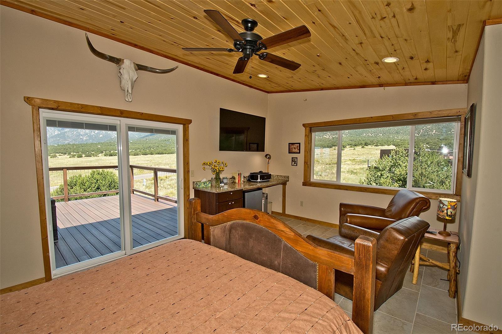3421 Camino Del Rey Crestone, CO 81131 - Photo 34 of 41 a bedroom with furniture and large window