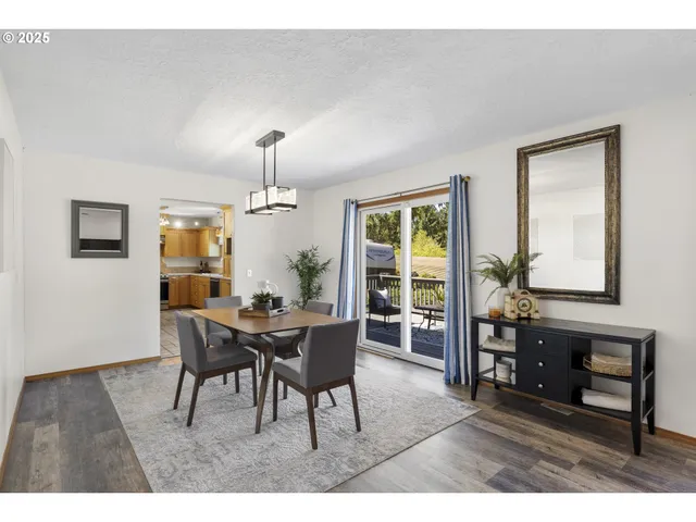 a dining room with furniture and window