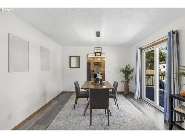 a dining room with furniture and window