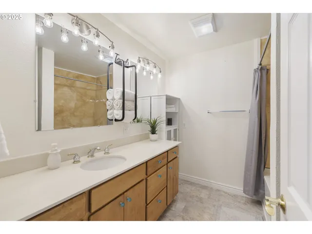 a bathroom with a sink double vanity and a mirror