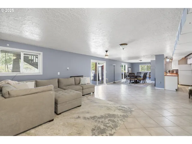 a living room with furniture and a table