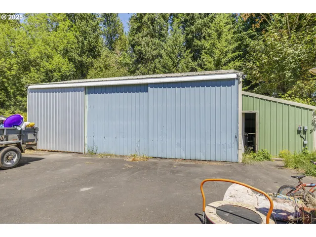 an aerial view of a house with yard