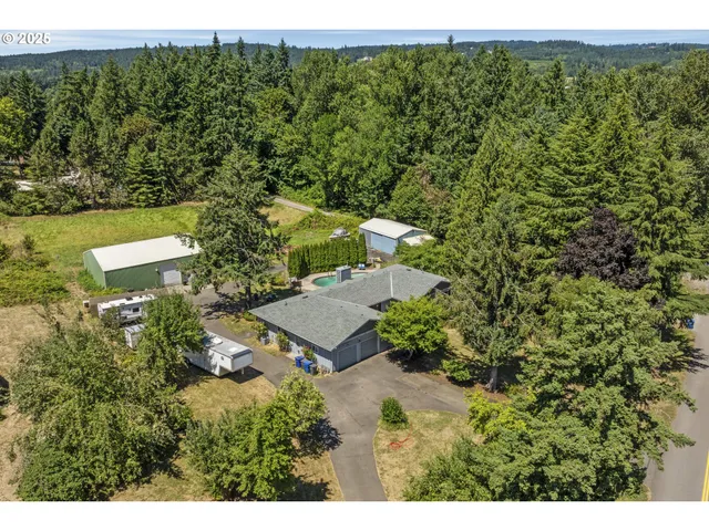 a aerial view of ocean with residential house and outdoor space
