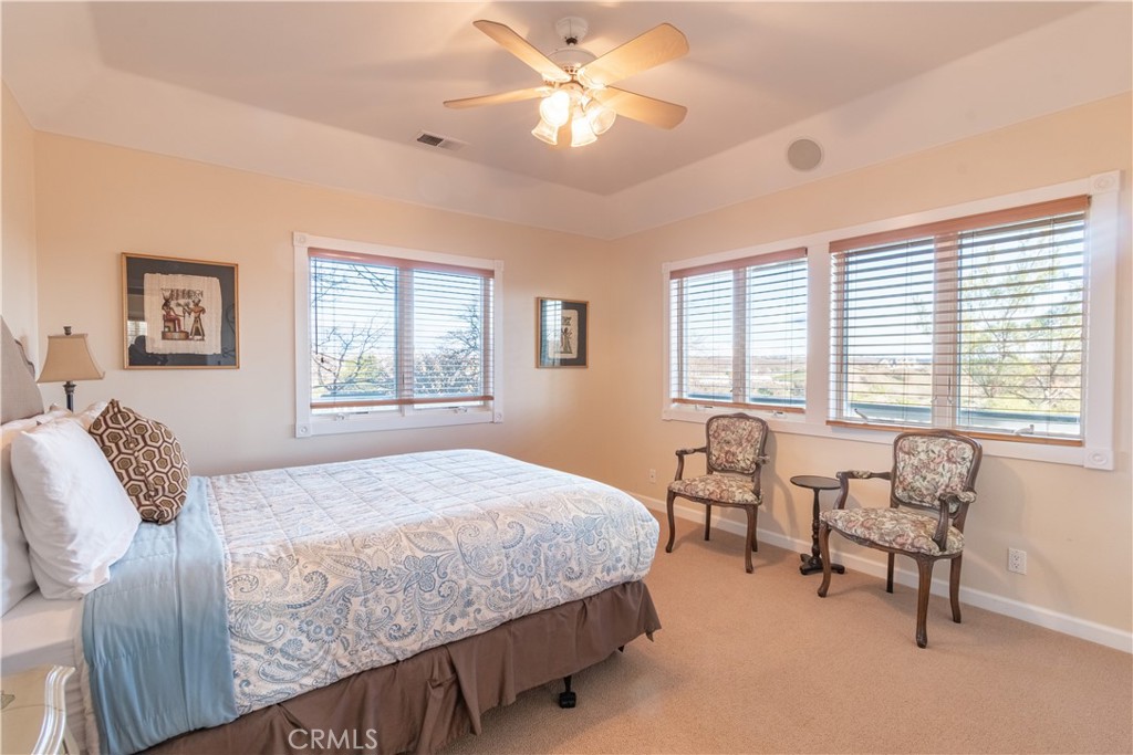 390 San Marcos Road Paso Robles, CA 93446 - Photo 11 of 62 a bedroom with a bed and a table chair